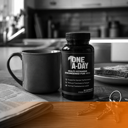 Black One A-Day multivitamin bottle beside a mug on a kitchen counter