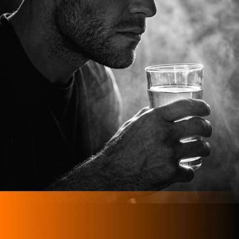 MenTools blog feature image for MEN: 8 Simple Nutrition Habits for Busy Men, black and white photograph with orange MenTools overlay