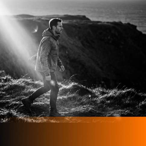 MenTools blog feature image for MEN: 8 Habits That Actually Make Men Happier, black and white photograph with orange MenTools overlay
