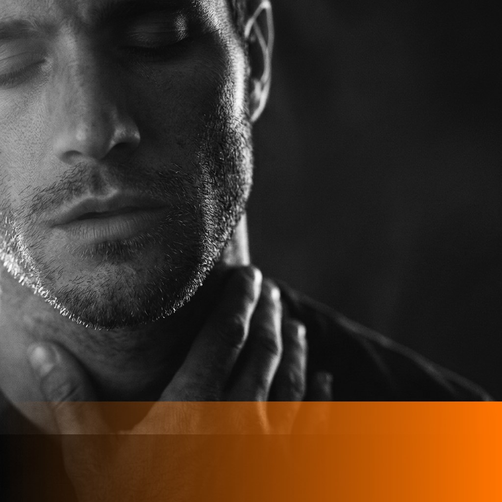 MenTools blog feature image for how to reset your nervous system, black and white close-up photograph of a man with his eyes closed and a hand against his neck, orange MenTools overlay band